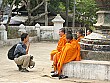 Winston makes friends with a novice monk named Savay.