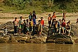 Hmong children gather by the river to see us off.