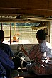Barbara takes a turn driving our river boat.  Watch out for those crazy rocket boats!