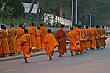 Their baskets full of rice and other food offereings, the monks return to the monestery to eat, meditate, and pray.