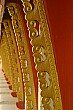 Gold and red details of the Pha That Luang in Vientiane.