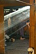 Sunlight streams through the smoky kitchen of our homestay.