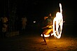Local villagers perform a flaming stick dance for us at night.