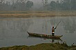 The river boat man starts work early to bring us to the Elephant Breeding Center in the early morning.
