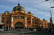 Famous Flinders Street Station in the Central Business District of Melbourne.  One of the City Circle trams can also be seen on the right.