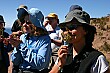 Jen and Rochelle take a whiff of some peppermint growing by the side of the path, Lake Titicaca.