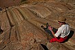 John tries out a natural rock slide at Sacsaywaman.